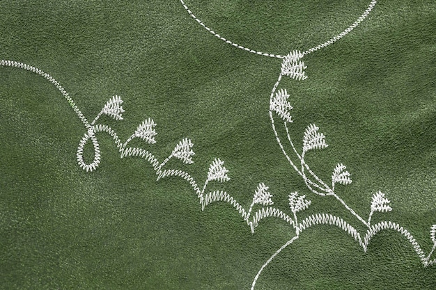 Modern embroidery pattern on fabric